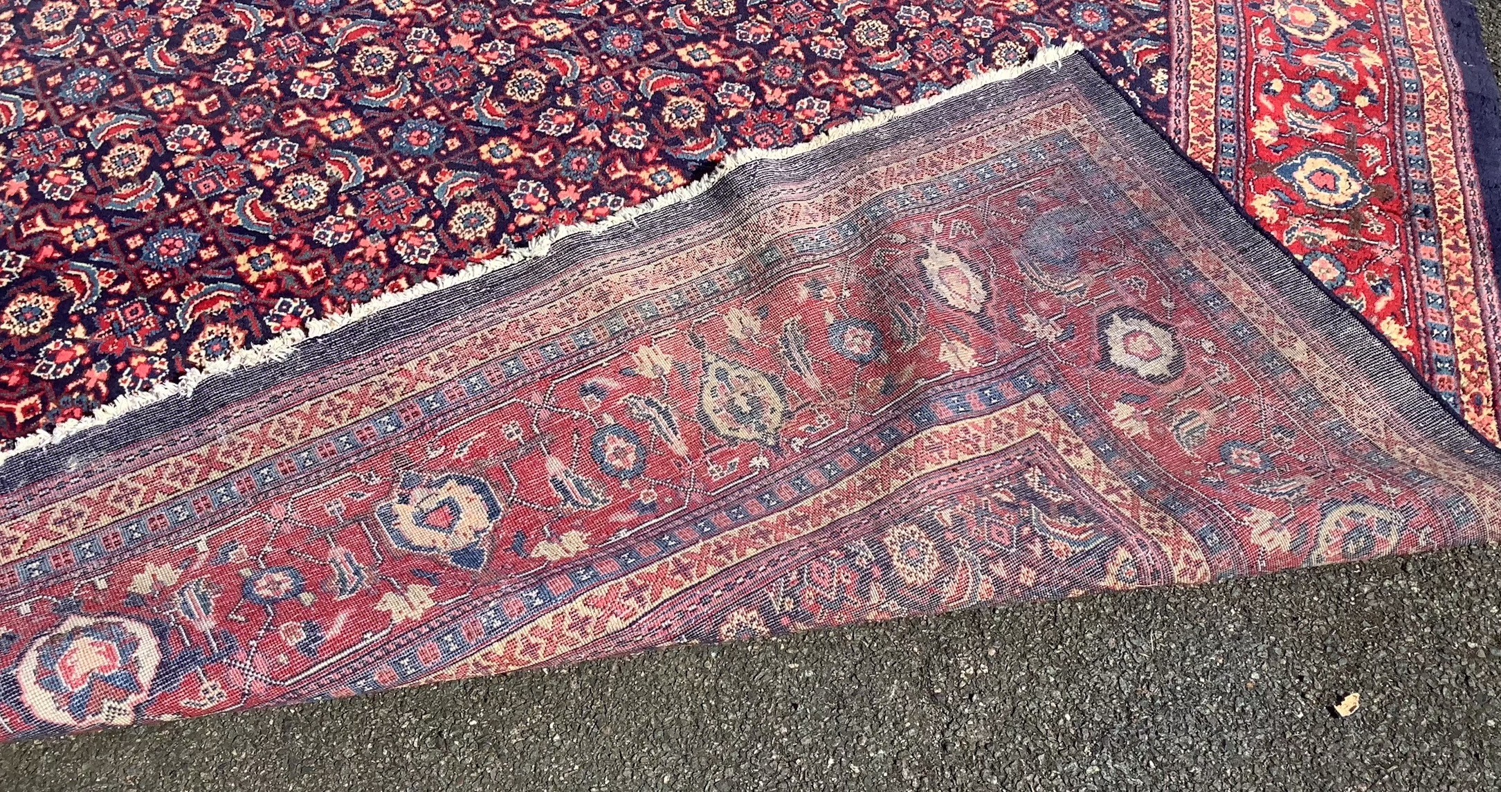 A North West Persian blue ground carpet, 534 x 325cm